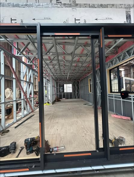 Steel-frame transportable structure with timber subfloor, ready for cladding